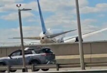 passenger plane crash in america with truck and streetlight