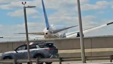 passenger plane crash in america with truck and streetlight