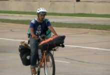 japanese student see football match on bicycle